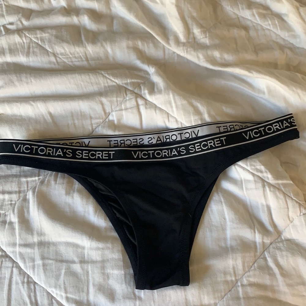 Black Victoria’s Secret swimsuit bottoms